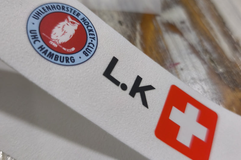 UHC Hamburg custom grip with initials and Swiss flag